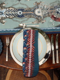 A table setting with an Ardmore designs table cloth and napkin