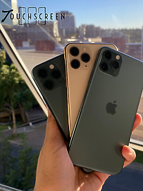 3 iphones in hand with a view