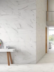 A stunning floor to ceiling white marble bathroom with tiles from Stiles.