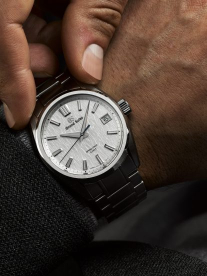 A beautiful, classic men's watch from Grand Seiko on the wrist of a man