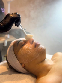 Woman receiving a facial