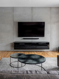 A modern grey lounge with minimal finshes