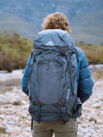 Man hiking with a Gregory Pack bag