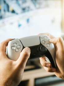 Hands holding a PS5 controller