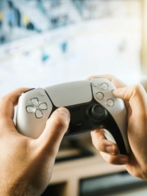 Hands holding a PS5 controller