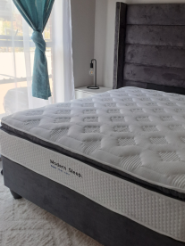 A modern sleep bed in a stylish bedroom